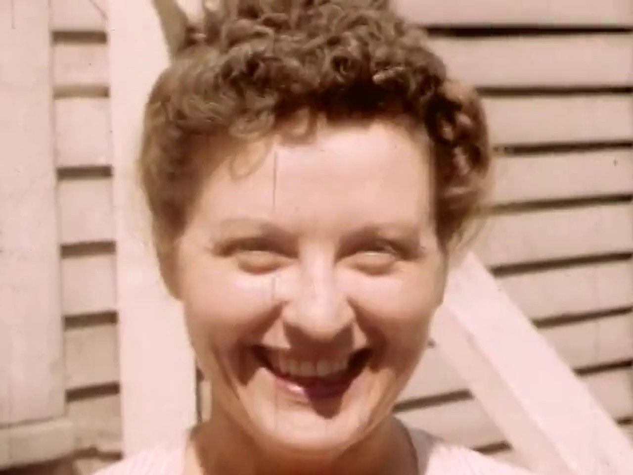 Original frame from the same 1952 film, soft and faded